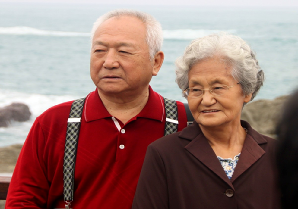 Senior couple with ocean in background