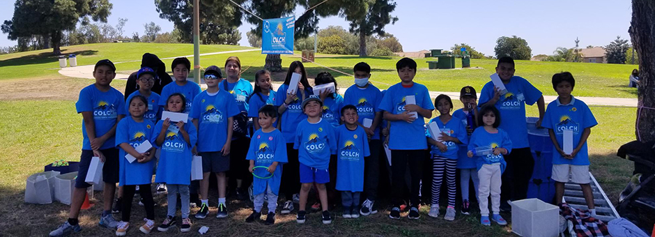 campers pose for photo in their blue camp shirts