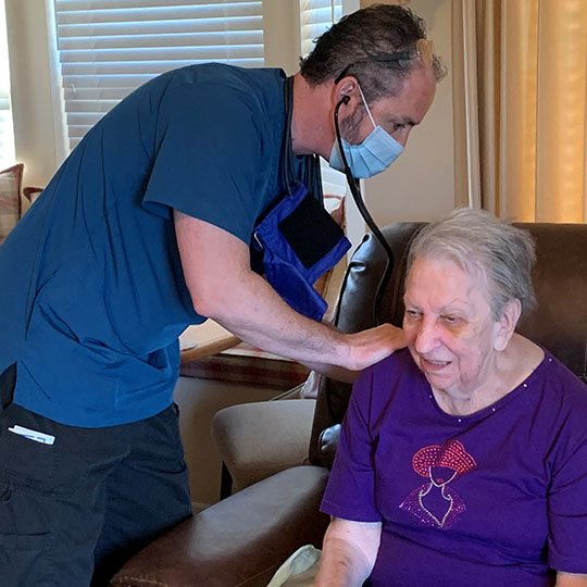 Medical worker helping patient