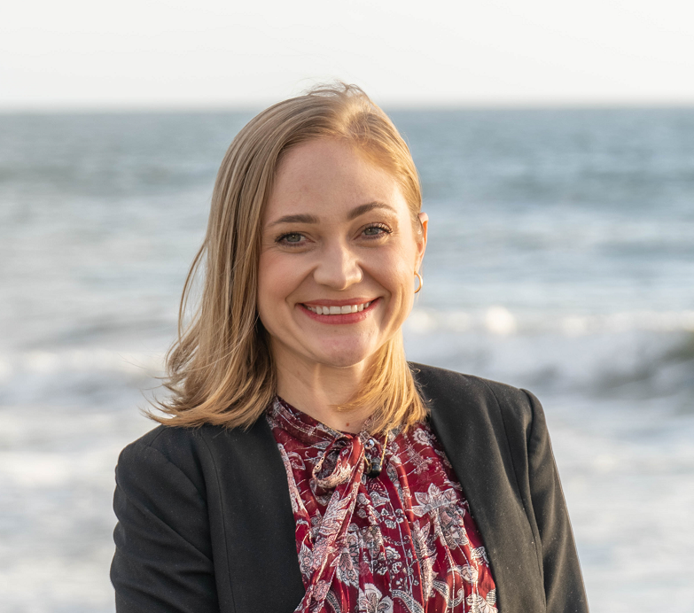 Sharon Hughes in front of the ocean