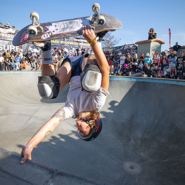 1x1 Exposure Skate Competition skateboarder one handed handstand on lip of a bowl