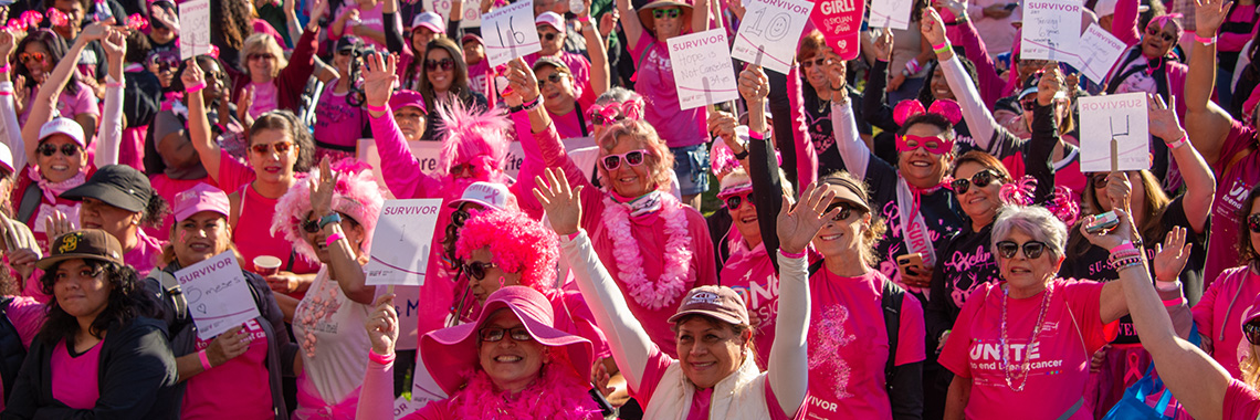 3x1 Susan G Komen event participants all in pink cheer