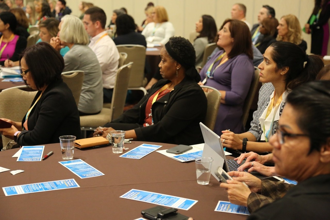 people sitting at table during SDCOE Annual Summit